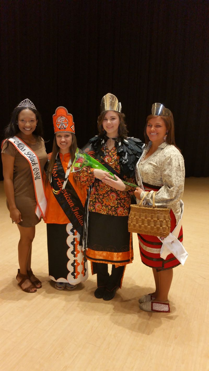 Miss American Indian OSU Meg pictured alongside two former Miss American Indian OSU titleholders and Miss Black OSU at her MAIOSU pageant.