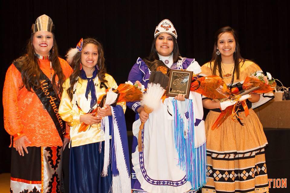 Miss American Indian OSU Veronica posing with former Misses and contestants from the MAIOSU pageant.