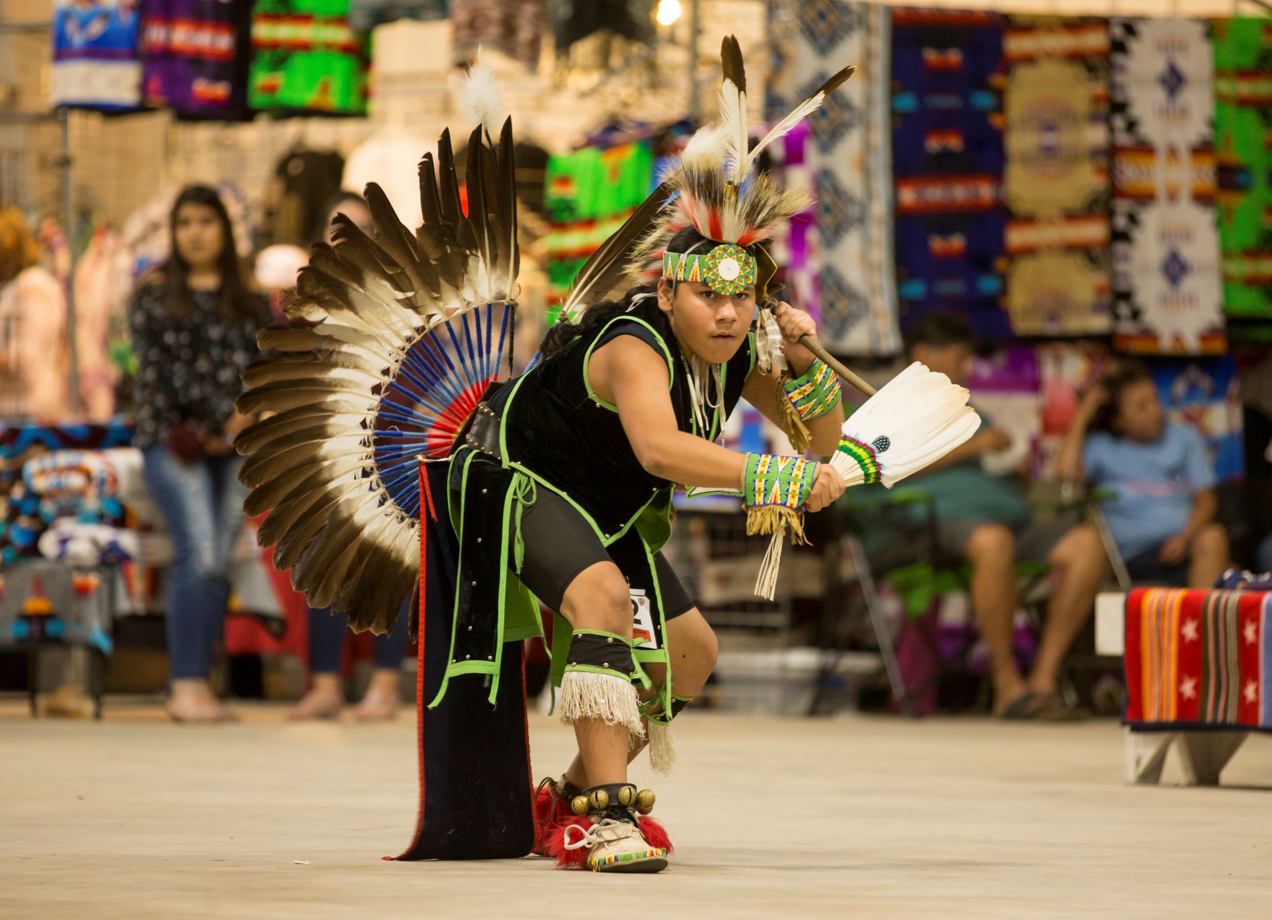 Men’s Traditional dancer in regalia performing at a powwow competition.