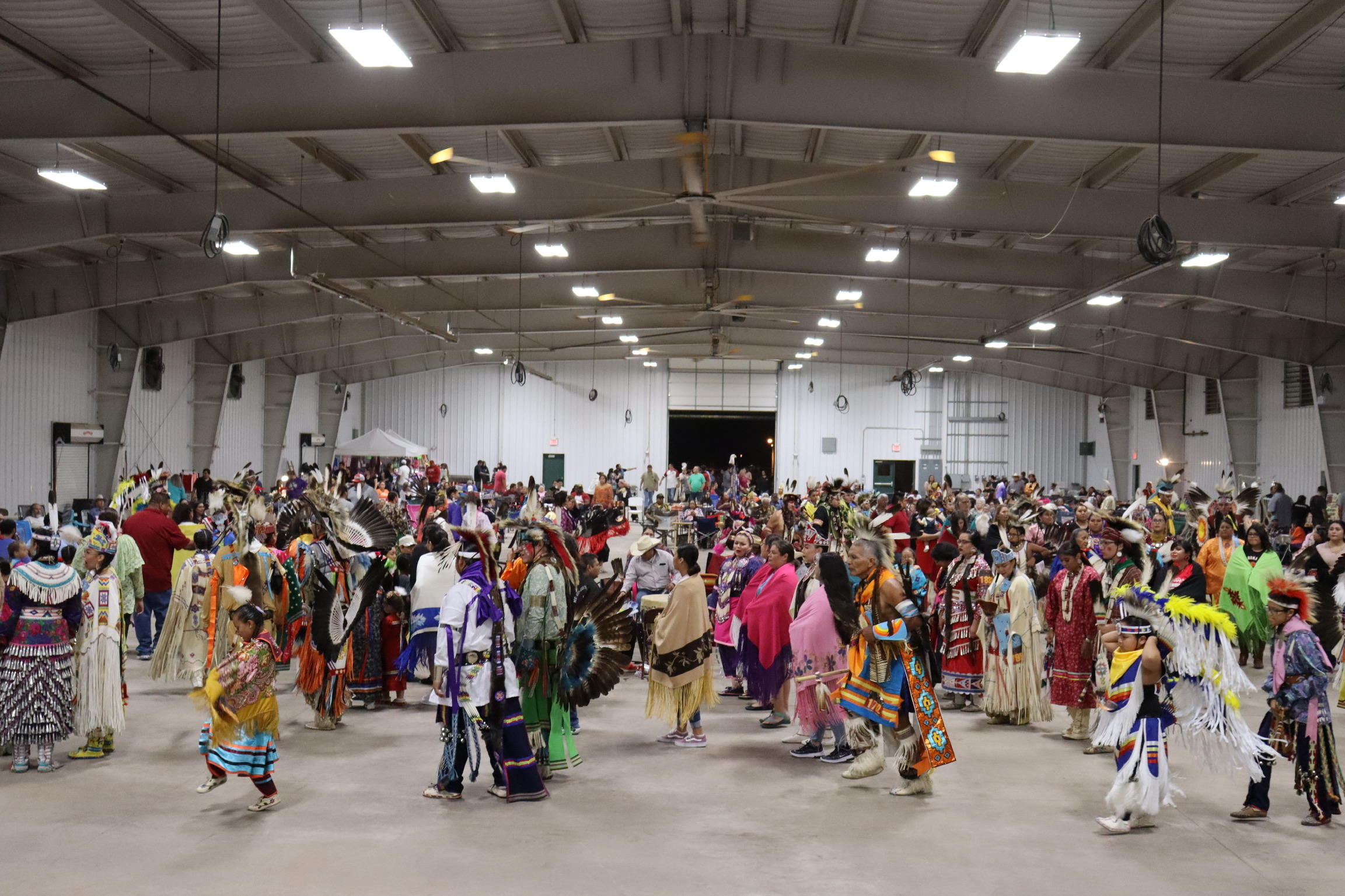 Powwow photo of people dancing in grand entry